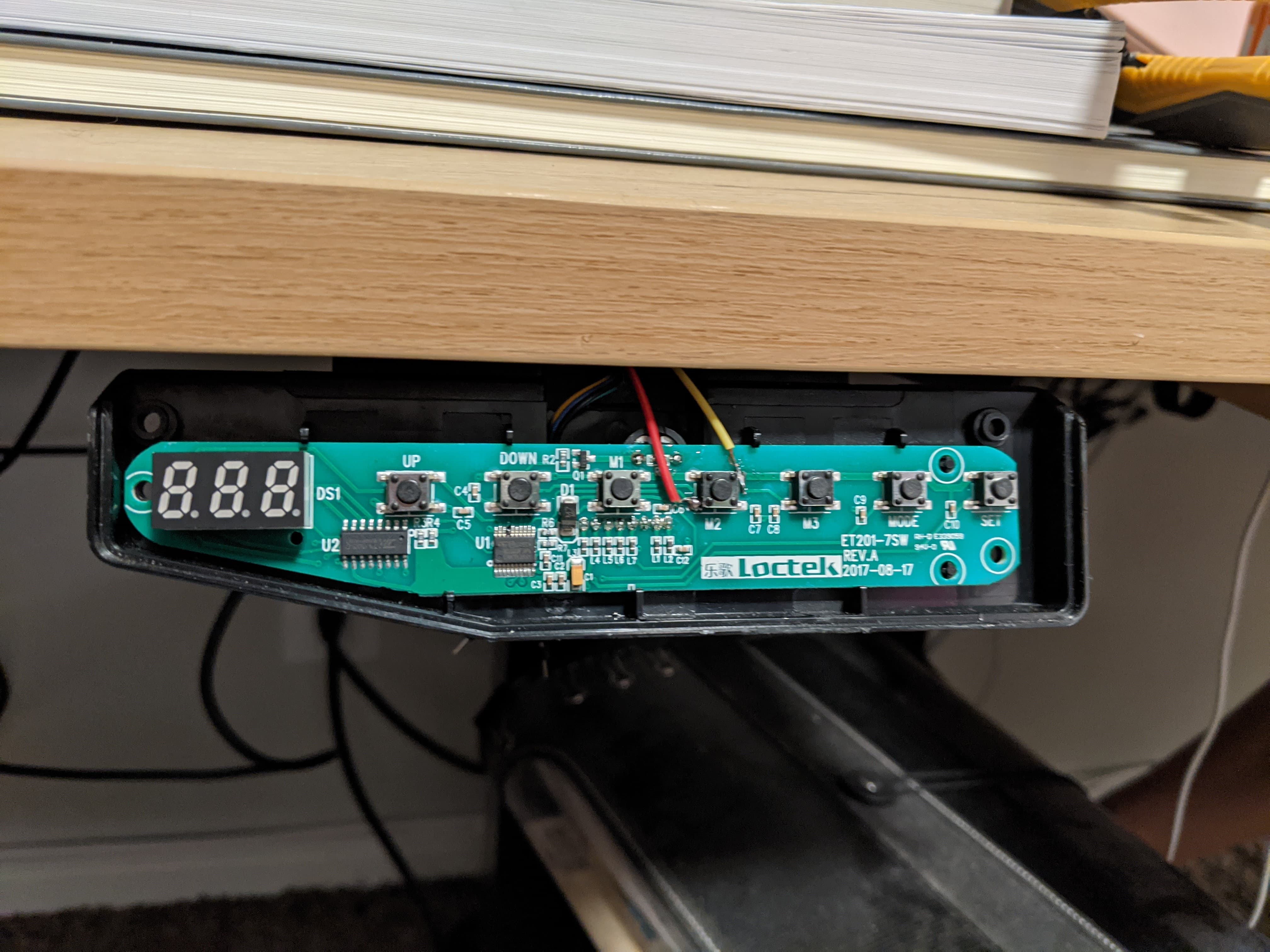 The wires soldered onto my standing desk 2nd height setting button